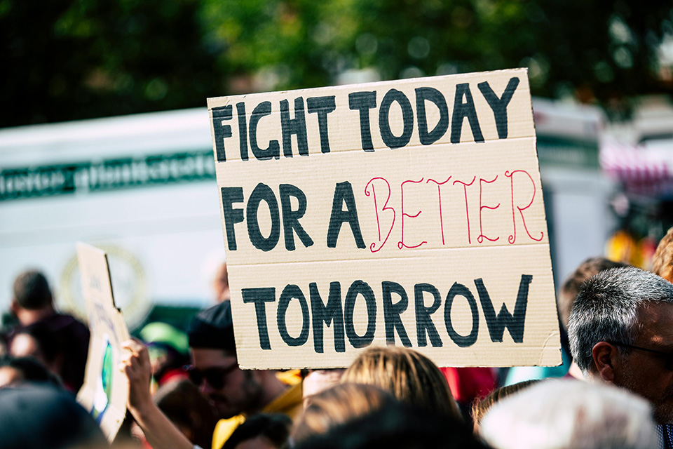 a close up of a sign protest sign that says Fight Today for a better Tommorrow