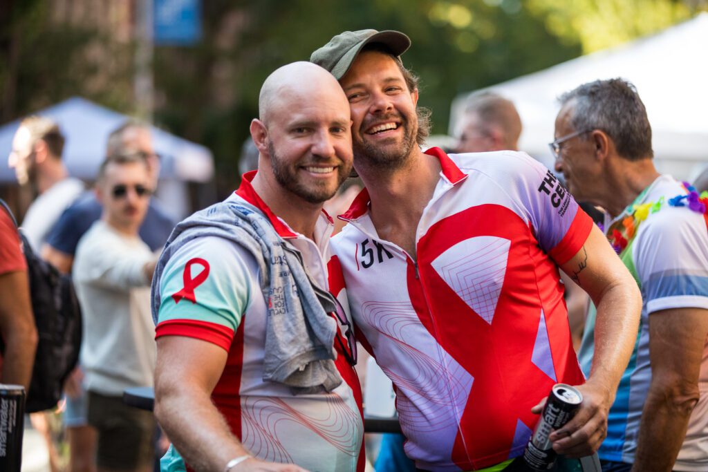 two cyclist smile