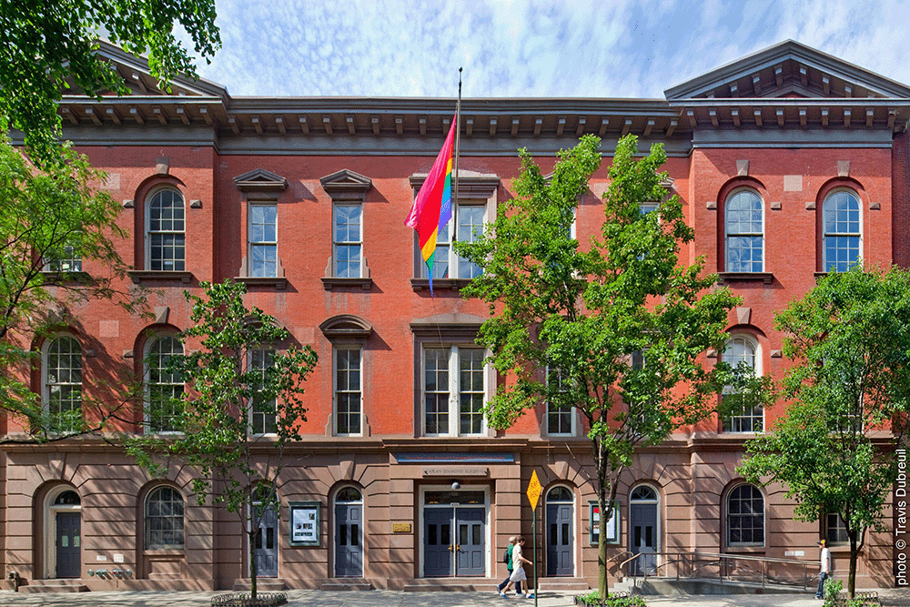 a photographic rendering of the front of The Center on a sunny day