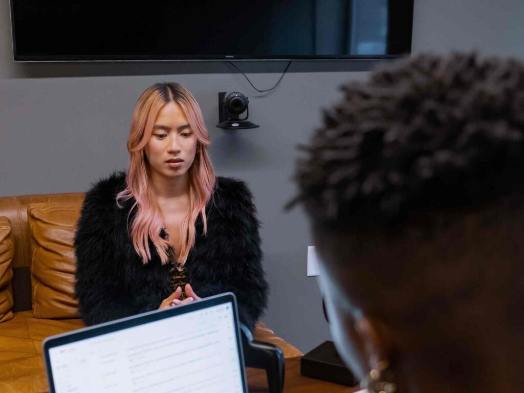 Transfeminine And Non Binary Colleagues Talking In An Office for Counseling at The Center