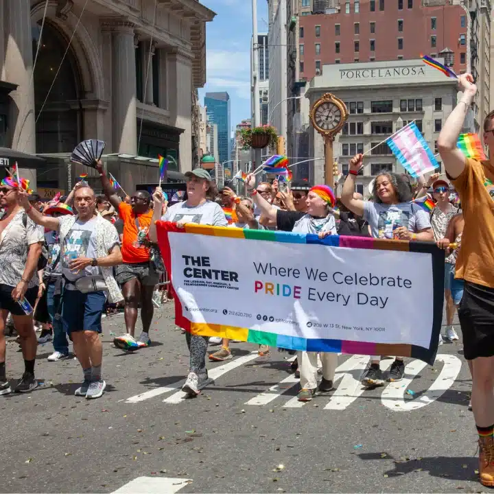 Marchers holding banner for The Center