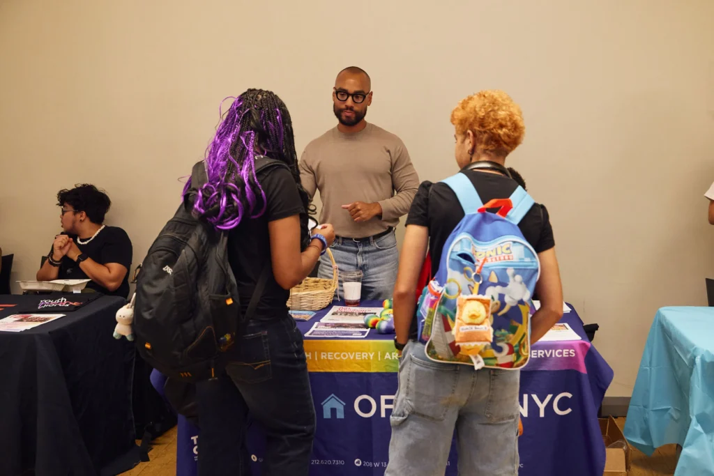 LGBTQ youth with backpacks discussing resources