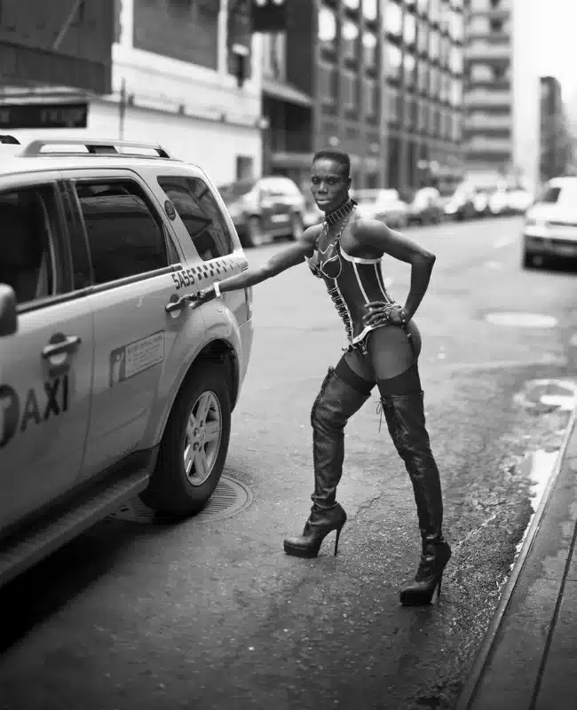 Queer person posing for LGBTQ photographer